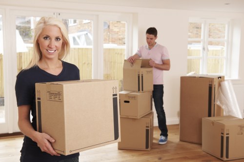 Removal team loading boxes and furniture for a Holland Park relocation
