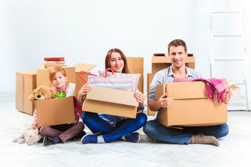 Driver and helper preparing goods for transport at the end of a move