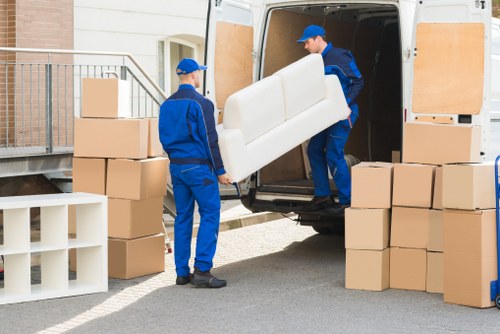Removal team handling a family house move in Holland Park