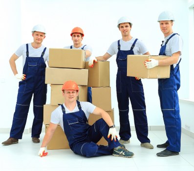 Packing and loading household items for a move in Holland Park