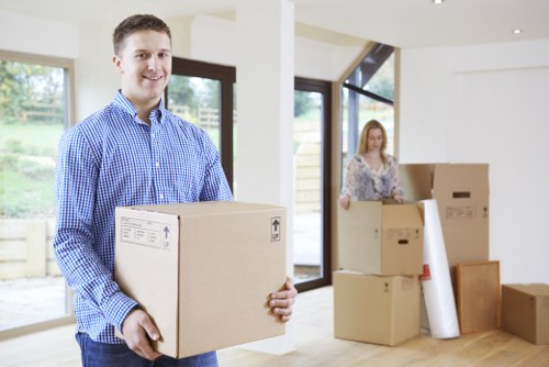 Loading furniture and boxes into a removal truck for a Holland Park move
