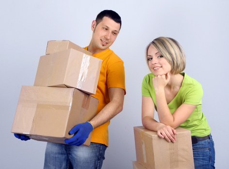 Loading boxes and household items into a van for a local move