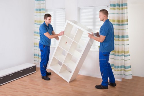 Professional house movers managing access and loading in Holland Park