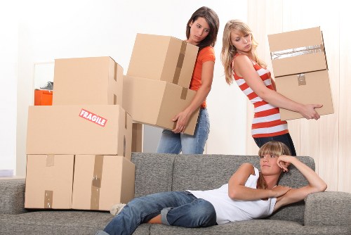 Moving team handling furniture and boxes during a relocation
