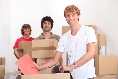 Boxes and furniture arranged for unloading during a Holland Park relocation